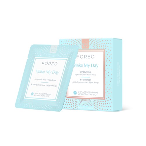 Eine Hautpflegeproduktverpackung mit einer Maske namens 'Make My Day' von FOREO, mit feuchtigkeitsspendenden Inhaltsstoffen wie Hyaluronsäure.