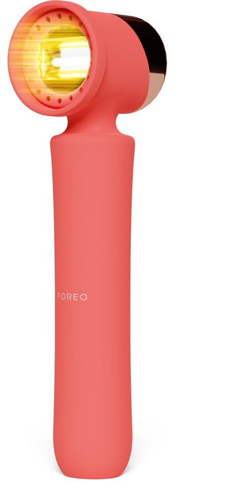 Roze huidverzorgingsapparaat met een verwarmd, felgeel licht aan de bovenkant. Slank handvat, klein formaat, voor gezichtsbewerking.