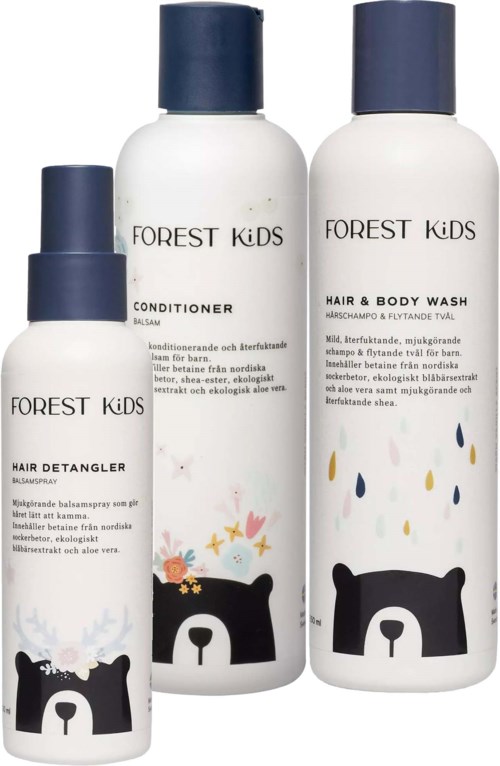 Three white bottles with blue caps labeled Forest Kids hair and body care products, featuring a bear illustration.