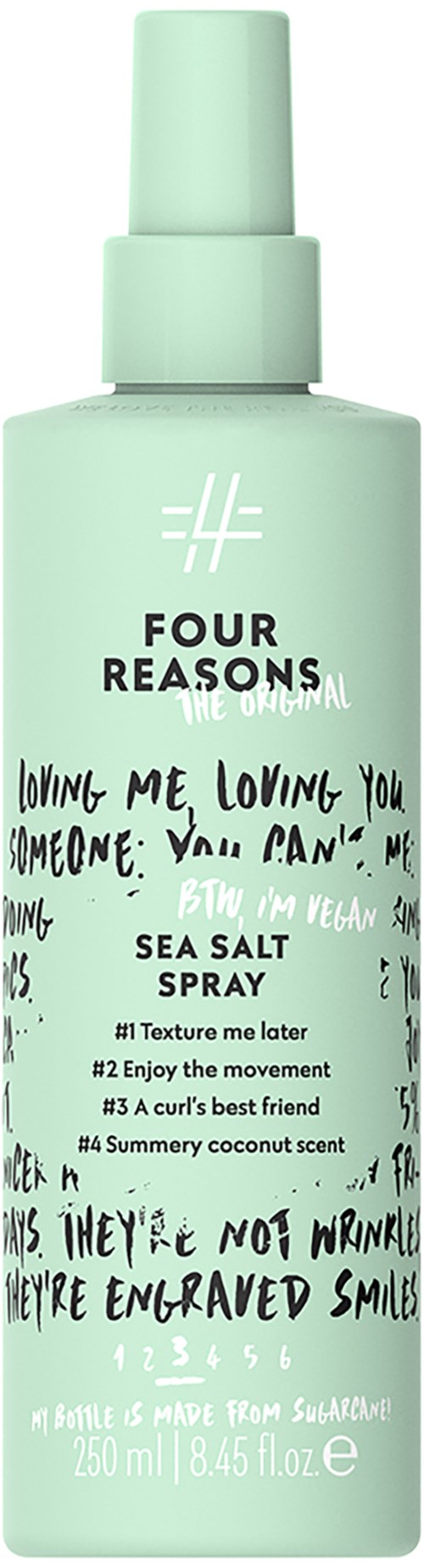 En mintgröngul spraya-flaska med etiketten 'Four Reasons Sea Salt Spray' och handskrivna texter samt sprayhuvud.
