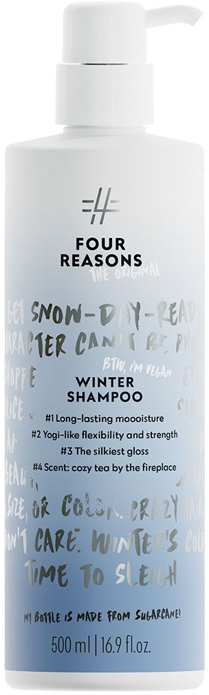 En hvit flaske med vinter-shampoo med en etikett som beskriver egenskapene og duften, og en pumpehendel.