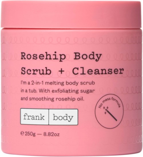 Een roze pot met label 'Rosehip Body Scrub + Cleanser' en een kleine cirkel die 'No mess formula' aangeeft.