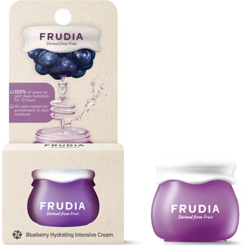 Pieni violetti purkki, jossa on mustikkakosteusvoide ja vastaava laatikko, jossa mustikoita ja vesipisara.
