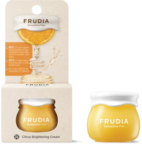 Ein Glas mit Zitrusaufhellungscreme mit gelbem Deckel, beschriftet 'Frudia,' mit einer Orange auf der Verpackung.