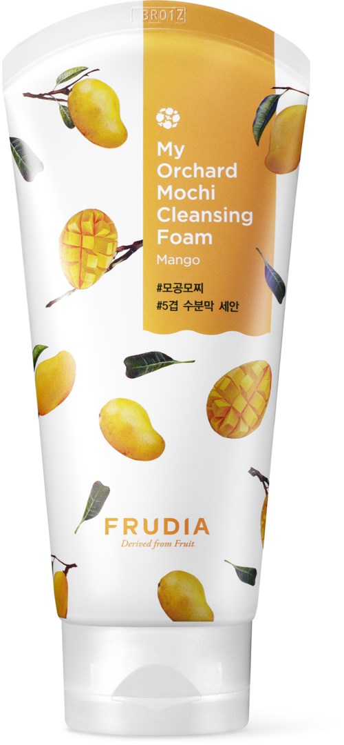 A mango-scented facial cleansing foam tube with mango images and text, branding as Frudia's orchard mango cleansing foam.