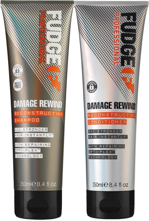 Twee zilveren en zwarte haarproducten, shampoo en conditioner, voor haarherstel en versterking.