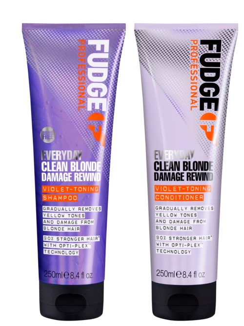 Twee haarverzorgingsbussen, één paars en één zilver, voor blondeschadeherstel en violet-kleuring.