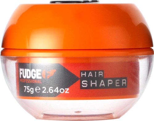 Kierroksen oranssi säilykepurkki, jossa lukee Fudge Hair Shaper, 75g, ja näkyy punainen sisältö sisällä.