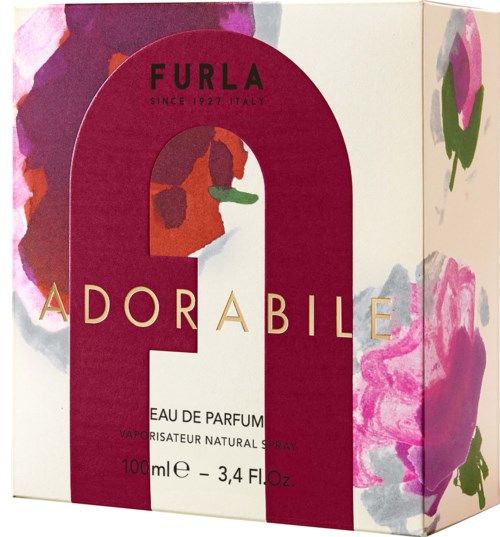 Furla Adorable parfymask box har blommönster och rosa design, med en fet röd 'A' och parfymdetaljer.