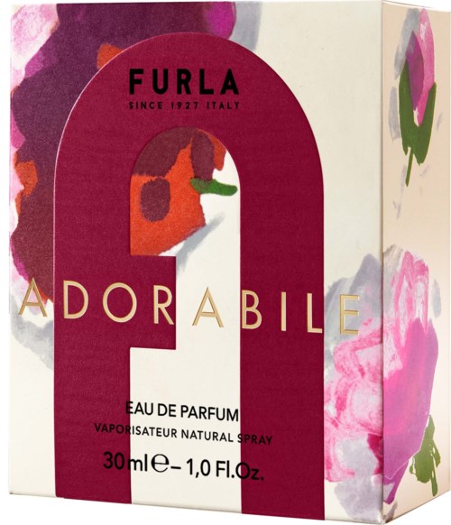En parfymförpackning märkt 'Furla Adorable' med blommiga och rosa designer.