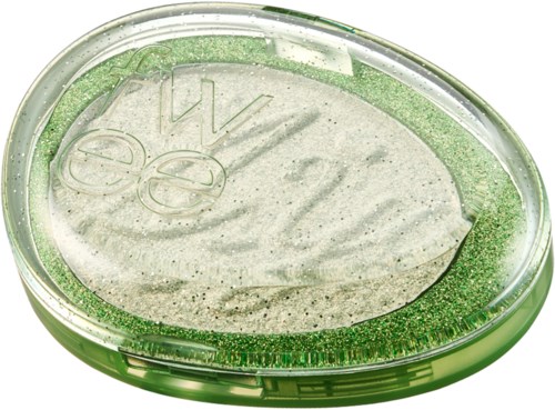 Grönt och klart ovalt behållare med en virvel av vitt inuti och grönt glitter runt kanterna.