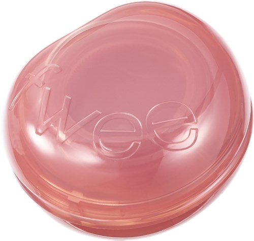 Ett runt rosa föremål med genomskinligt lock och ordet "We" präglat på toppen.