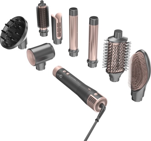 Een set verschillende stijltang- en krulapparaten, inclusief diverse cilinders, borstels en een verwarmde stylestick.