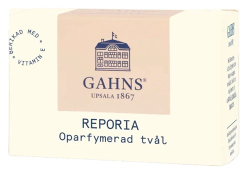  Tvål i en rosa förpackning med märket Gahns. Den är oparfymerad och innehåller Vitamin E. Bilden visar också ett byggnadssymbol.