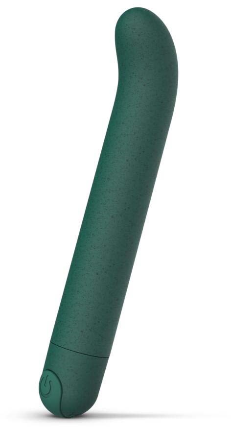 A green, curved object with a button at the base, resembles a personal massager or device.