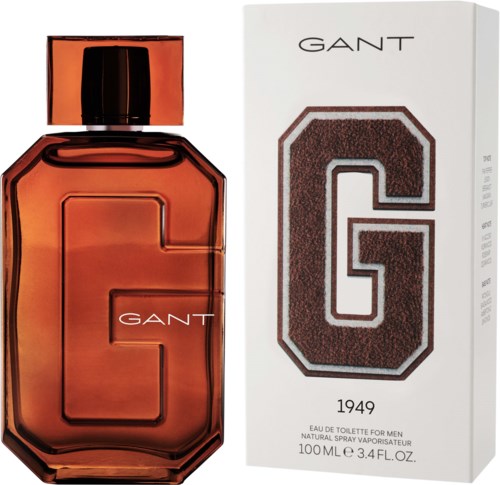 Ein GANT-Parfümflasche in Bernsteinfarbe neben einer Schachtel mit großem G und GANT-Logo.