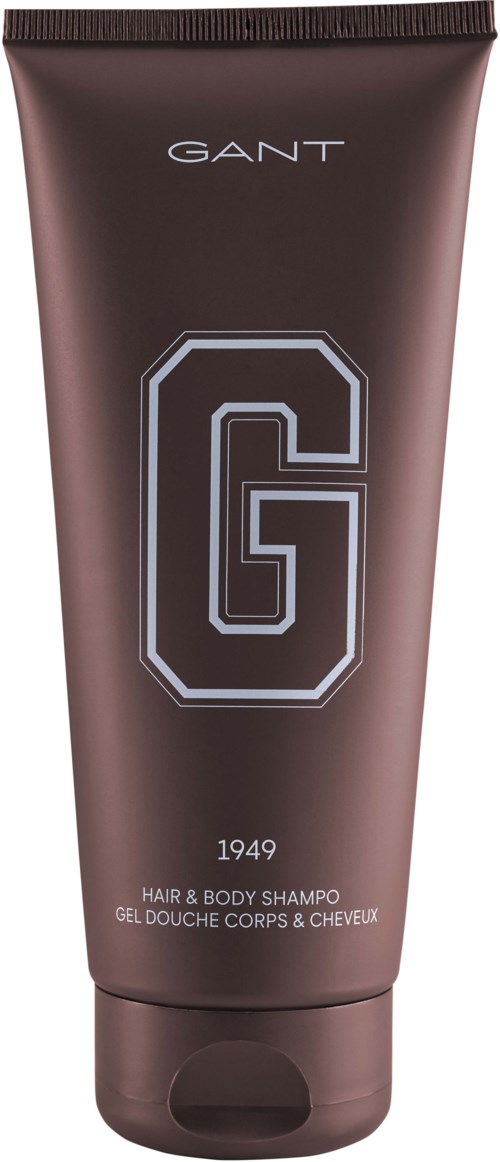 Braune Tube mit der Aufschrift 'GANT 1949 HAIR & BODY SHAMPOO' und einem großen 'G'-Logo in der Mitte.
