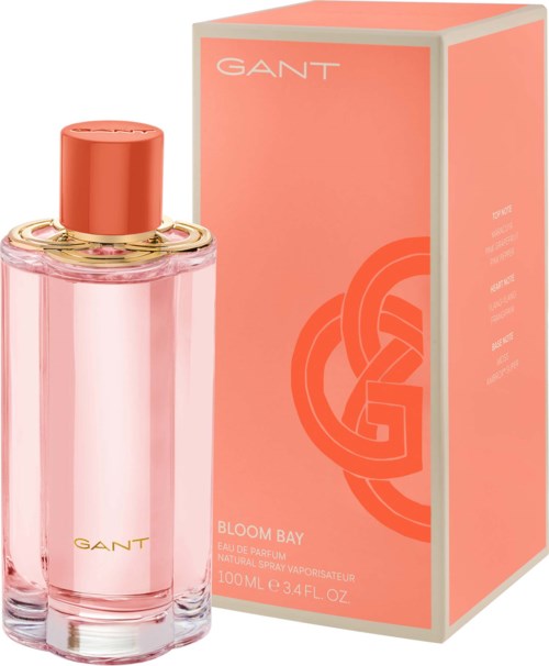 Rote Parfüfflasche und orange Verpackung mit GANT-Logo und Bloom Bay Beschriftung.