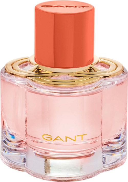 Eine rosa Parfümflasche mit goldenem Ring und korallenfarbigem Deckel von GANT. Elegant und stilvoll.