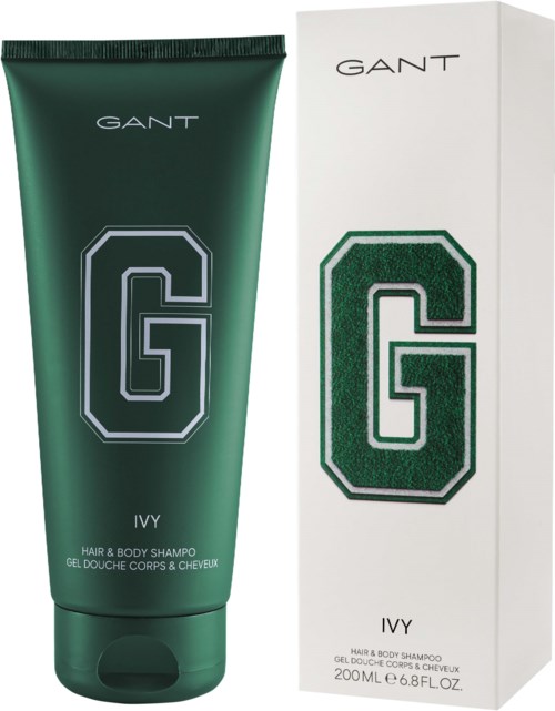 Eine grüne Tube GANT Ivy Haar- und Duschshampoo neben der weißen Verpackung.