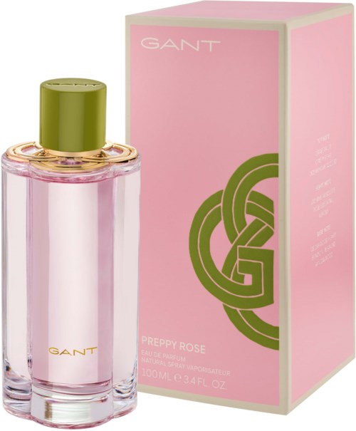 Rote Parfümflasche mit grünem Verschluss, neben einer rosa Schachtel mit grünem und weißem Design, GANT Preppy Rose.
