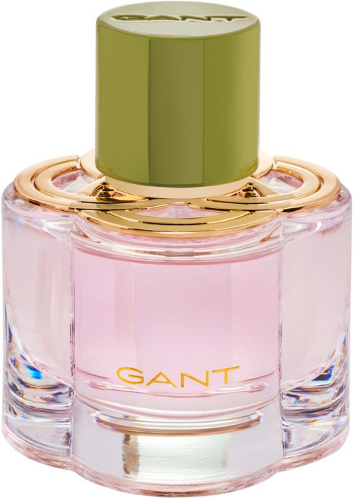 Es ist eine GANT-Parfumenflasche mit rosa Flüssigkeit, goldenen Details und einem hellgrünen Deckel.
