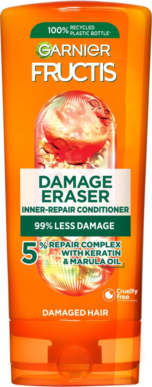 A Garnier Fructis Damage Eraser conditioner bottle, orange with green and white labels, featuring product benefits and hair type.