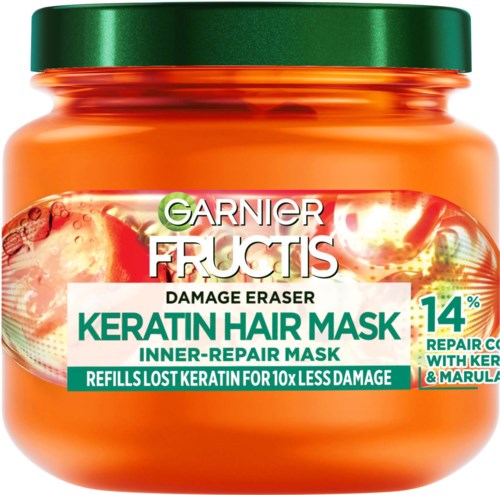 Een pot Garnier Fructis Keratin Hair Mask voor haarherstel met groene deksel, oranje container en gedetailleerd label.