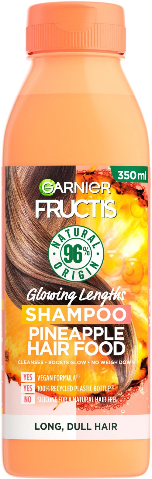 En flaska Garnier Fructis ananas hårvårdschampo för långt, matt hår, innehåller 350 ml med naturliga ingredienser.