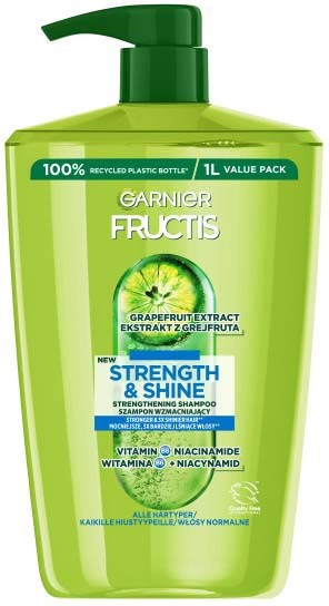Groene shampoo fles met pomp, gemarkeerd Garnier Fructis, bevat grapefruit extract en belooft kracht en glans.