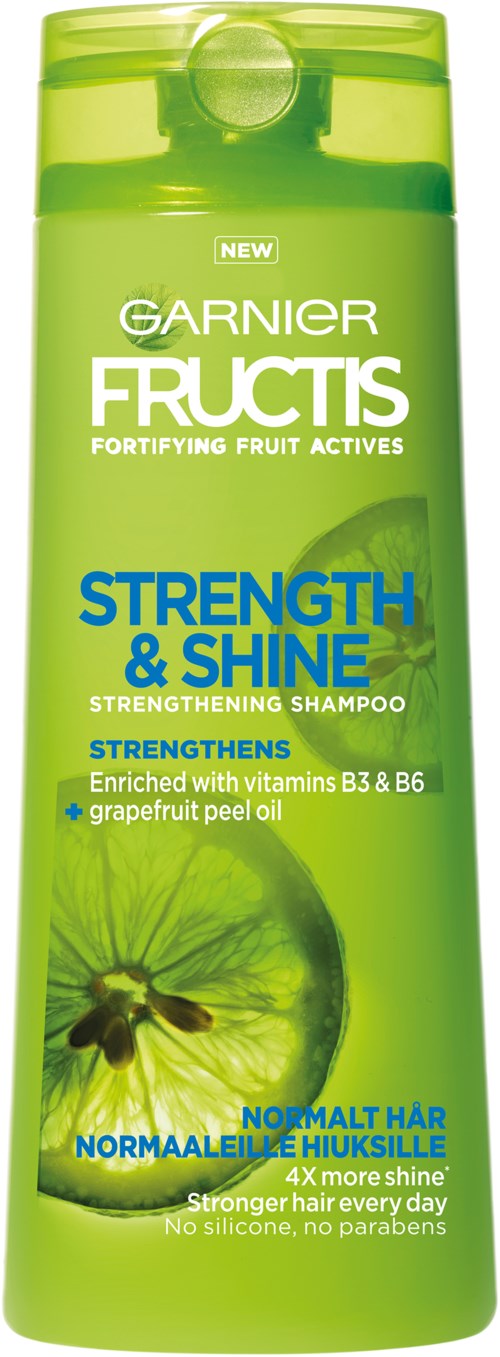 Eine grüne Shampooflasche mit blauer und weißer Schrift, erwähnt die Stärkung der Haare mit Vitaminen und Grapefruitöl.
