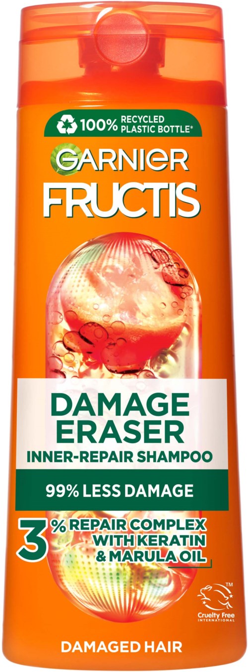 Oranje fles Garnier Fructis Damage Eraser shampoo met groen label, toont 99% minder schade en Repair Complex-logo.