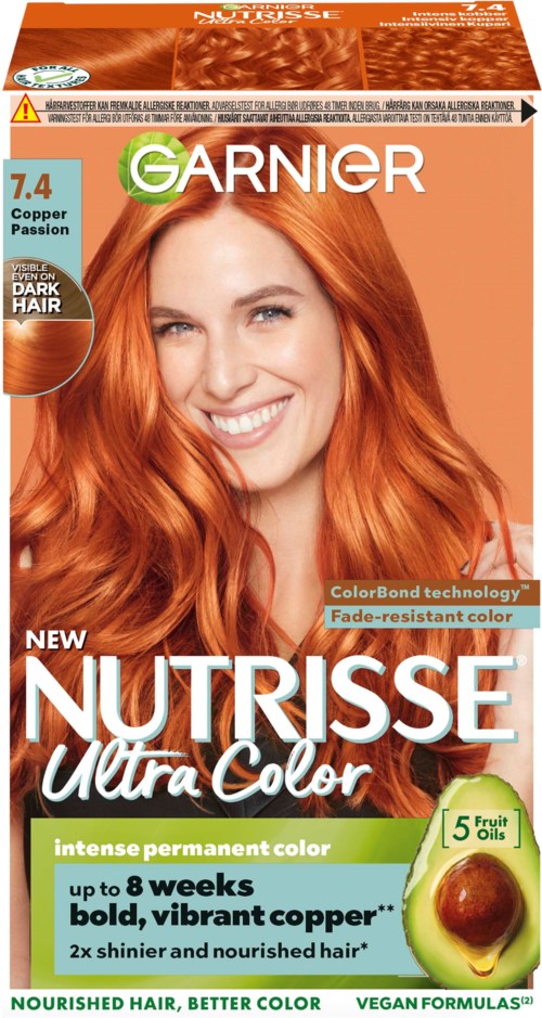 Eine Haarfärbereihe mit einer lächelnden Frau mit langen, leuchtend roten Haaren. Die Box hebt Farbtechnik und langanhaltende Farbe hervor.
