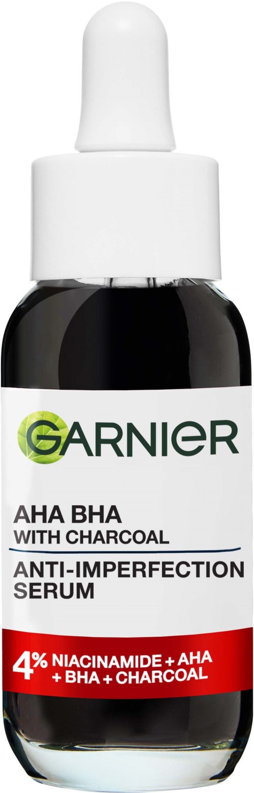 Serum Garnier na trądzik i rozszerzone pory, zawiera niacynamid, AHA, BHA i węgiel aktywny, w małej butelce z kroplomierzem.