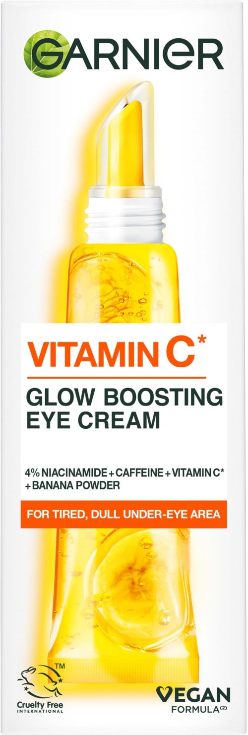 Een huidverzorgingsfles met gele vloeistof, gelabeld als Garnier Vitamin C Eye Cream voor vermoeide ogen, cruelty-free en veganistisch.