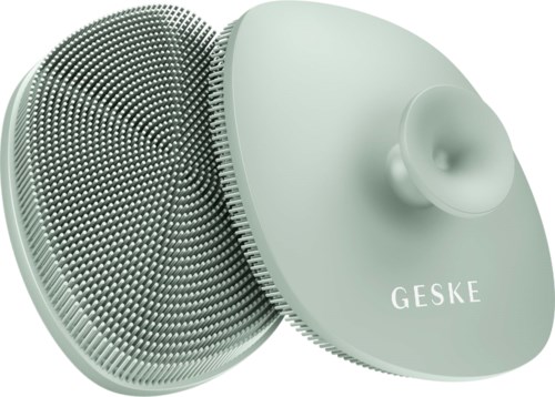 Eine Silikon-Gesichtshaarbürste mit rundem Kopf und weichen Borsten, mit der Aufschrift 'GESKE'.