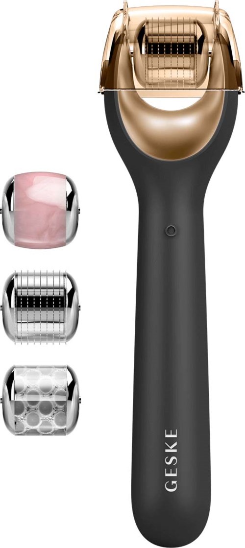 Ein schwarzer und goldener Elektrorasierer mit drei verschiedenen Folienköpfen und einem rosa Peeling-Kopf. Die Marke ist GESKE.