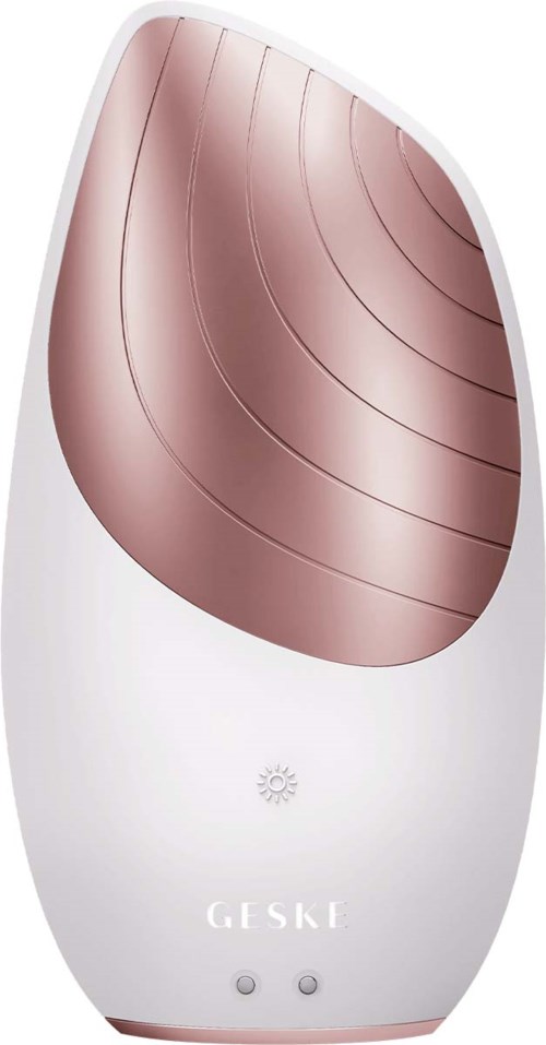 Ein weißes Gerät mit roségoldenem oberen Teil, Tasten und kleinem Display. Es sieht aus wie eine Gesichtsreinigungsbürste.