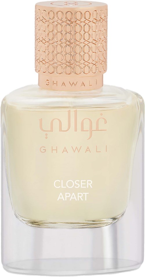 A glass perfume bottle with a beige cap and a cream-colored liquid inside. The label says Ghawalli and Closer Apart.