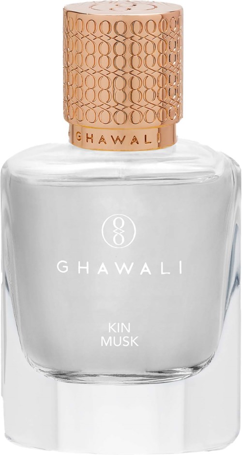 A clear glass perfume bottle with a gold cap and white label reading Ghawali Kin Musk.