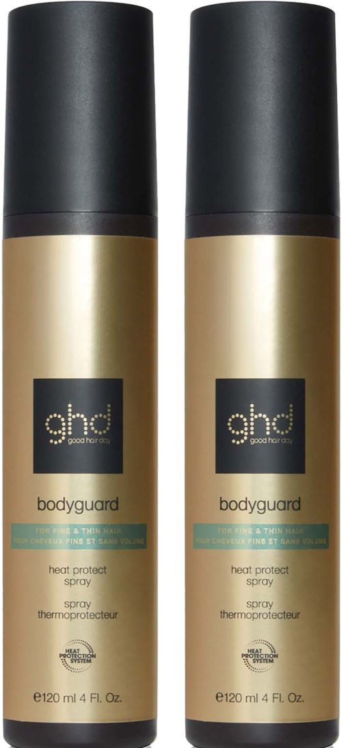 Two gold-colored spray bottles with black caps labeled 'ghd bodyguard heat protect spray' for hair.