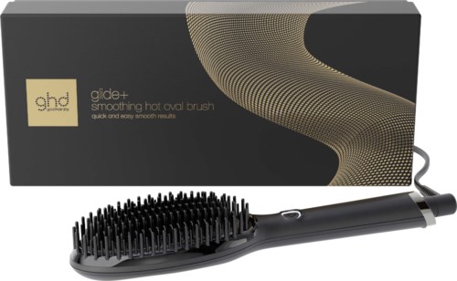 An electric hot brush with a black handle, bristles, and a box with gold and black design.