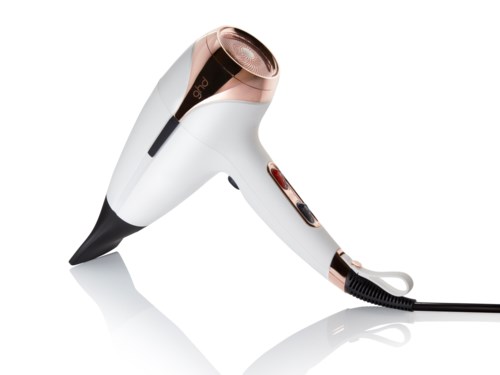A white and rose-gold hair dryer with a black cord and a button, looks sleek and modern.