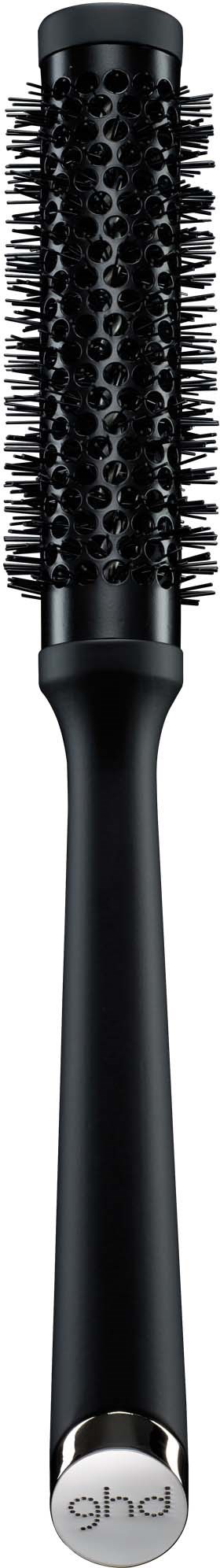 A black round hairbrush with bristles and patterned hole details, long handle, on a black background.
