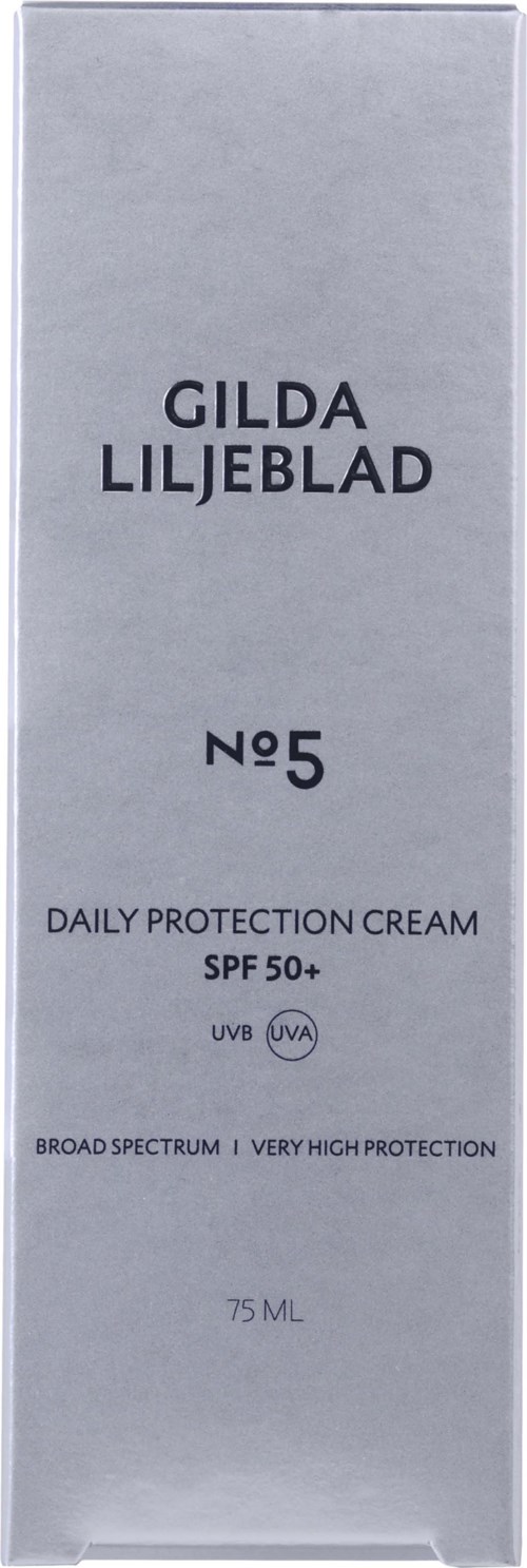 Een lange grijze doos met zwarte tekst toont de productnaam, SPF-classificatie en beschermingsinformatie van een huidcrème.