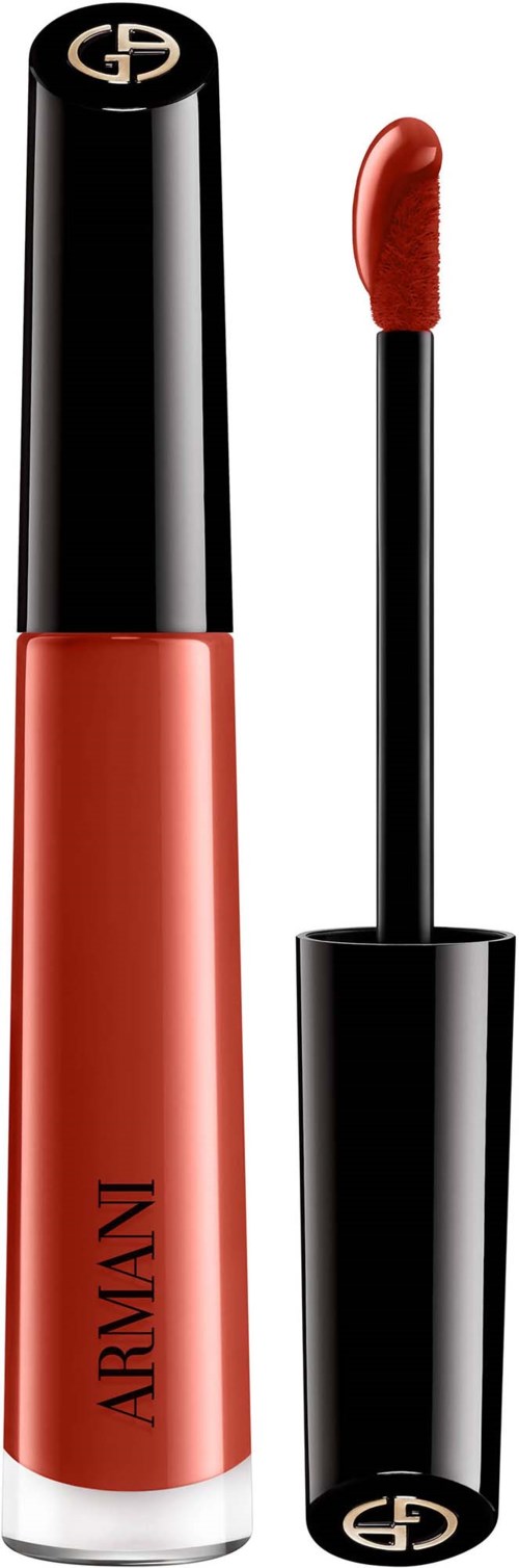 A coral-colored lip gloss tube with black cap and a matching applicator with a curved tip.