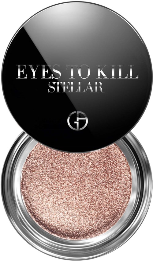 Pyöreä kosmetiikkapakkaus, jossa on hohtava vaaleanpunainen luomiväri. Lipasessa lukee "EYES TO KILL STELLAR" ja logo.