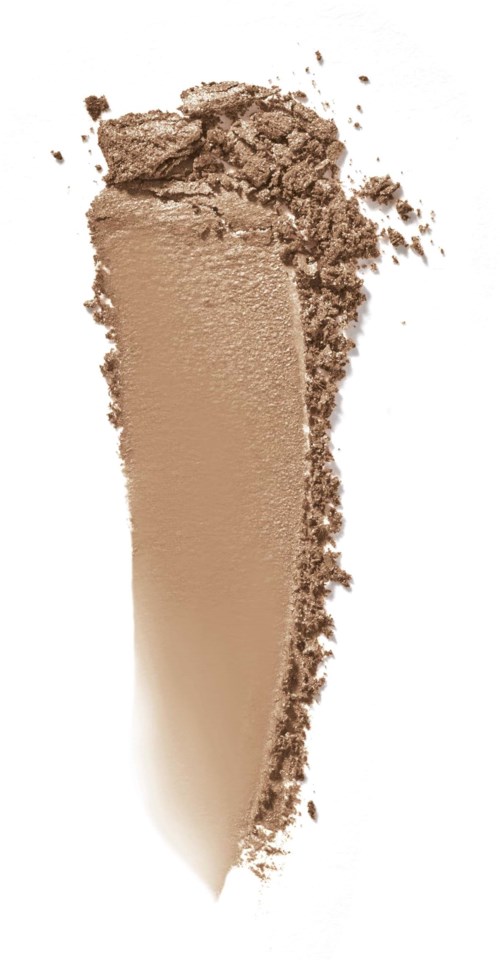 A beige powder, possibly makeup or foundation, with some loose particles around it.