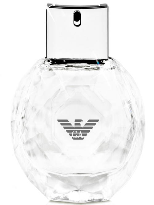 Eine klare, runde Parfümflasche mit silberner Kappe und einem Adler-Logo in der Mitte.