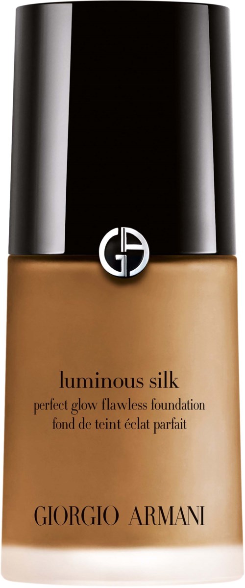 En foundationflaska med svart lock och beige vätska, märkt 'Luminous Silk' av Giorgio Armani.